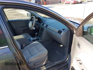 2005 Ford Five Hundred SE z VIN 1FAFP231X5G145153, wystawiony jako IAAI lot #42059747 z przebiegiem 59 114 mil mil oraz . Historia ofert i sprzedaży dostępna na DreamBid. Obrazek 5.