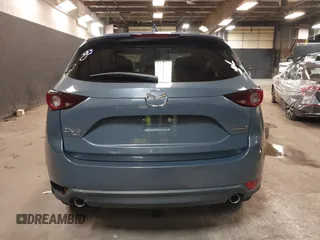 2021 Mazda CX-5 Touring with VIN JM3KFBCM5M0394707, listed as a IAAI auction lot 41887973 with 44,670 mi miles. Bid and sale history available at carsss.com. Image 17.