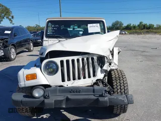 2001 Jeep Wrangler Sahara with VIN 1J4FA59S51P332107, listed as a IAAI auction lot 40954726 with 150,671 mi miles. Bid and sale history available at carsss.com. Image 12.