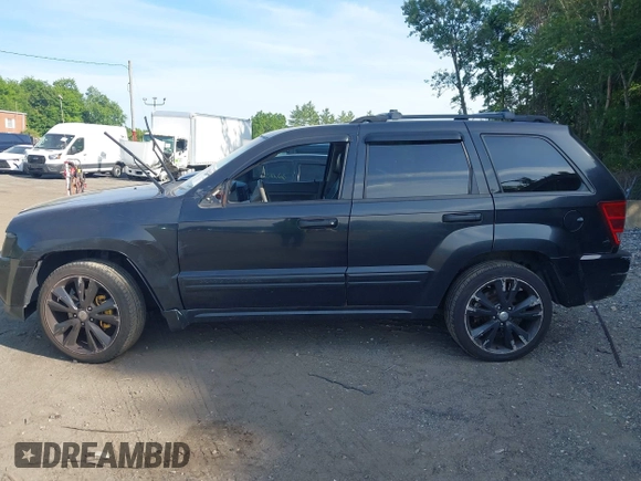 2005 Jeep Grand Cherokee Laredo z VIN 1J4GR48K65C725099, wystawiony jako IAAI lot #42509223 z przebiegiem 249 216 mil mil oraz . Historia ofert i sprzedaży dostępna na DreamBid. Obrazek 15.