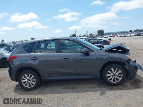 2014 Mazda CX-5 Sport with VIN JM3KE2BE0E0411377, listed as a IAAI auction lot 42143229 with 137,384 mi miles and . Bid and sale history available at carsss.com. Image 13.