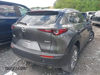 2023 Mazda CX-30 S Premium with VIN 3MVDMBDM2PM526974, listed as a IAAI auction lot 42155416 with 22,428 mi miles and . Bid and sale history available at carsss.com. Image 4.