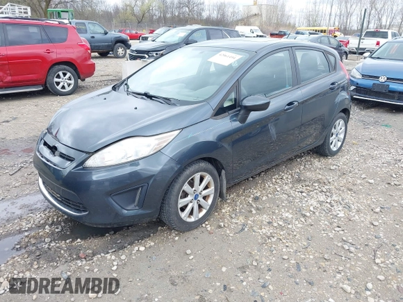 2011 Ford Fiesta SE with VIN 3FADP4EJ4BM228417, listed as a IAAI auction lot 42061494 with 86,873 mi miles. Bid and sale history available at carsss.com. Image 2.