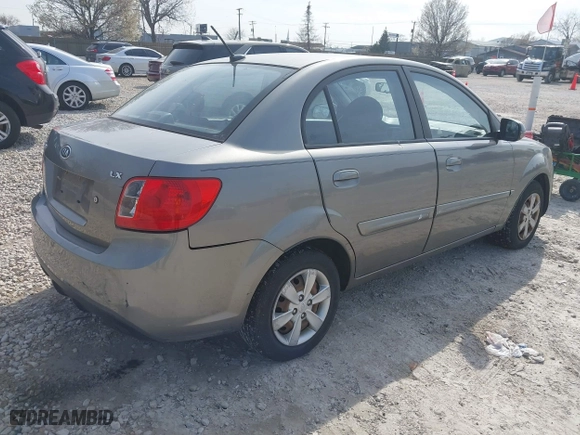 2011 Kia Rio LX with VIN KNADH4A39B6923388, listed as a IAAI auction lot 42060176 with 98,690 mi miles. Bid and sale history available at carsss.com. Image 4.