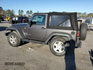 2016 Jeep Wrangler Willys Wheeler with VIN 1C4AJWAG5GL266235, listed as a Copart auction lot 50237195 with 60,830 mi miles and Salvage title. Bid and sale history available at DreamBid. Image 2.