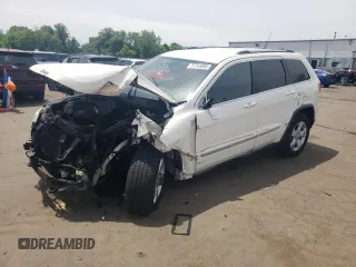 2011 Jeep Grand Cherokee Laredo z VIN 1J4RR4GG9BC516926, wystawiony jako Copart lot #57743895 z przebiegiem 143 293 mil mil oraz Szkoda całkowita • Salvage title. Historia ofert i sprzedaży dostępna na DreamBid. Obrazek 1.