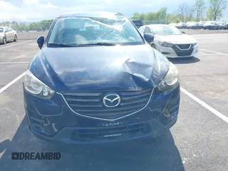 2016 Mazda CX-5 Sport with VIN JM3KE2BY3G0740488, listed as a IAAI auction lot 42000449 with 43,009 mi miles. Bid and sale history available at carsss.com. Image 12.