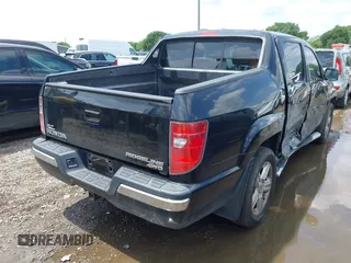2011 Honda Ridgeline RTL with VIN 5FPYK1F54BB011472, listed as a IAAI auction lot 42112512 with 194,974 mi miles and . Bid and sale history available at DreamBid. Image 4.