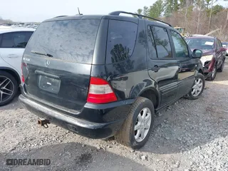 2000 Mercedes-Benz M-Class with VIN 4JGAB72E9YA208069, listed as a IAAI auction lot 41530528 with 155,967 mi miles. Bid and sale history available at carsss.com. Image 4.