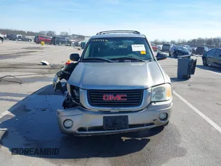 2002 GMC Envoy SLT z VIN 1GKDT13S122114452, wystawiony jako IAAI lot #42048616 z przebiegiem 259 545 mil mil oraz . Historia ofert i sprzedaży dostępna na DreamBid. Obrazek 13.