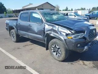 2021 Toyota Tacoma SR z VIN 3TMCZ5AN2MM387079, wystawiony jako IAAI lot #42164603 z przebiegiem 42 794 mil mil oraz . Historia ofert i sprzedaży dostępna na DreamBid. Obrazek 1.