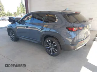 2023 Mazda CX-50 Premium Plus with VIN 7MMVABEY8PN100311, listed as a IAAI auction lot 42626276 with 40,242 mi miles and . Bid and sale history available at DreamBid. Image 3.