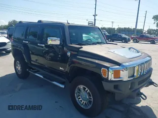 2007 Hummer H3 SUV with VIN 5GTDN13E878233953, listed as a IAAI auction lot 42012596 with 232,919 mi miles. Bid and sale history available at carsss.com. Image 1.