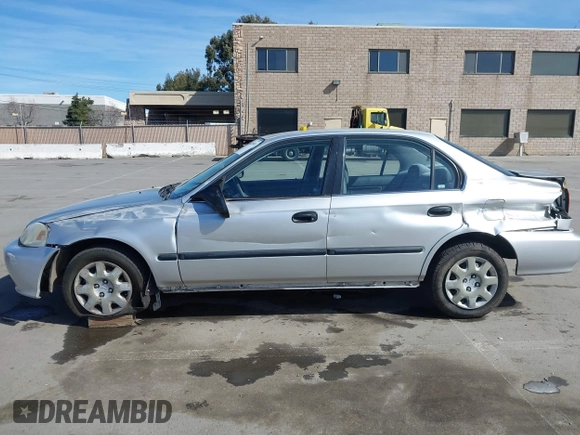 1999 Honda Civic LX with VIN JHMEJ6670XS000958, listed as a IAAI auction lot 41620949 with 93,698 mi miles and . Bid and sale history available at DreamBid. Image 14.