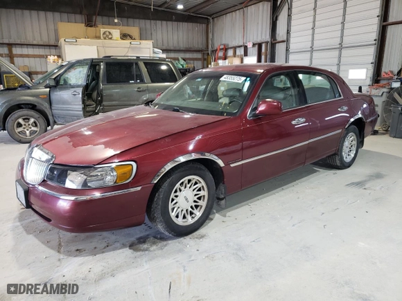 1999 Lincoln Town Car Signature with VIN 1LNHM82W6XY616896, listed as a Copart auction lot 48355275 with 168,128 mi miles and Salvage Title. Bid and sale history available at carsss.com. Image 1.