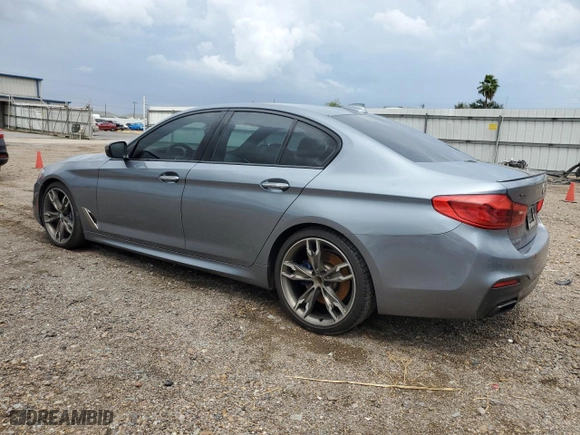 2018 BMW 5 Series M550i xDrive with VIN WBAJB9C50JB287269, listed as a Copart auction lot 69787724 with 100,526 mi miles and Salvage Title. Bid and sale history available at carsss.com. Image 2.