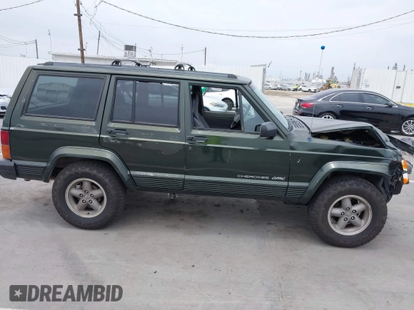 1996 Jeep Cherokee Sport z VIN 1J4FT68S6TL267408, wystawiony jako IAAI lot #42385629 z przebiegiem 268 753 mil mil oraz . Historia ofert i sprzedaży dostępna na DreamBid. Obrazek 13.