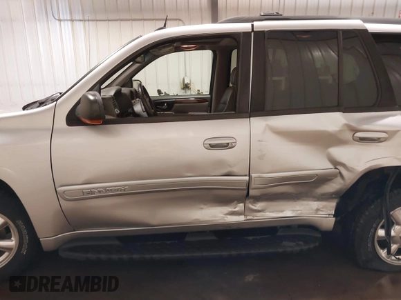 2004 GMC Envoy SLE with VIN 1GKDT13S042243883, listed as a IAAI auction lot 41795335 with 162,873 mi miles. Bid and sale history available at carsss.com. Image 14.