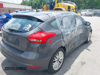 2016 Ford Focus Titanium with VIN 1FADP3N20GL275763, listed as a IAAI auction lot 42511959 with 124,891 mi miles and . Bid and sale history available at DreamBid. Image 4.