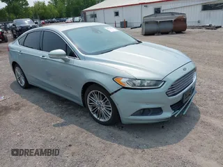 2013 Ford Fusion SE Hybrid z VIN 3FA6P0LU2DR127607, wystawiony jako IAAI lot #42373124 z przebiegiem 161 595 mil mil oraz . Historia ofert i sprzedaży dostępna na DreamBid. Obrazek 1.