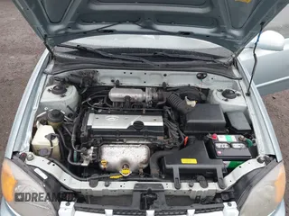 2003 Hyundai Accent GL with VIN KMHCG45C33U473080, listed as a IAAI auction lot 41868765 with 57,478 mi miles. Bid and sale history available at carsss.com. Image 10.