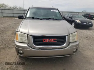 2003 GMC Envoy SLE z VIN 1GKDT13S332365071, wystawiony jako Copart lot #52811295 z przebiegiem Nie podano mil oraz Szkoda całkowita • Salvage title. Historia ofert i sprzedaży dostępna na DreamBid. Obrazek 5.