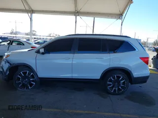 2022 Honda Pilot Special Edition with VIN 5FNYF5H29NB018557, listed as a IAAI auction lot 41402547 with 22,935 mi miles and . Bid and sale history available at carsss.com. Image 14.