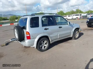 2003 Suzuki Grand Vitara with VIN JS3TE62VX34101622, listed as a IAAI auction lot 41689760 with 152,104 mi miles. Bid and sale history available at carsss.com. Image 4.