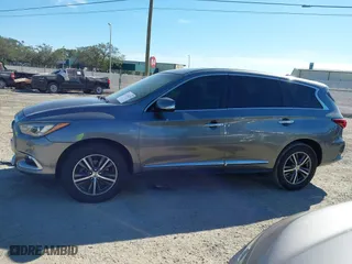 2016 Infiniti QX60 with VIN 5N1AL0MN5GC502797, listed as a IAAI auction lot 41242329 with 212,317 mi miles. Bid and sale history available at carsss.com. Image 14.