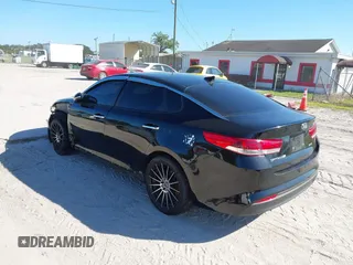 2018 Kia Optima LX with VIN 5XXGT4L3XJG203237, listed as a IAAI auction lot 40631696 with 157,012 mi miles and . Bid and sale history available at DreamBid. Image 3.