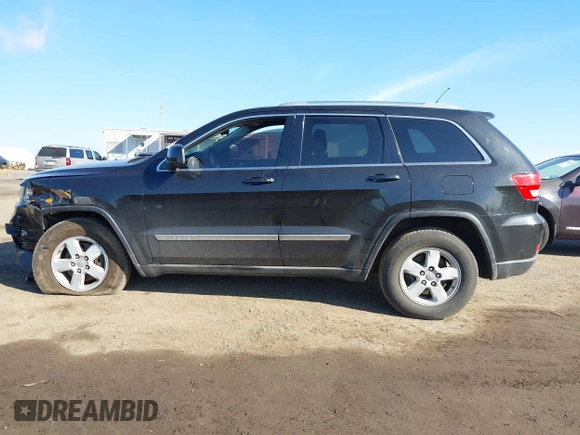 2012 Jeep Grand Cherokee Laredo with VIN 1C4RJFAG5CC118826, listed as a IAAI auction lot 42039801 with 158,153 mi miles. Bid and sale history available at carsss.com. Image 14.