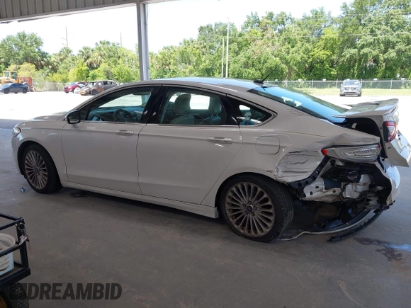 2016 Ford Fusion Titanium with VIN 3FA6P0K96GR390989, listed as a IAAI auction lot 42634275 with 123,559 mi miles and . Bid and sale history available at DreamBid. Image 14.