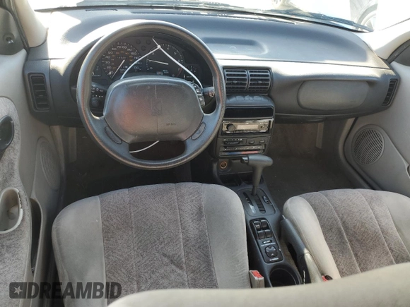 1996 Saturn SL with VIN 1G8ZK5279TZ162812, listed as a Copart auction lot 87079874 with 143,461 mi miles and Salvage title. Bid and sale history available at DreamBid. Image 8.