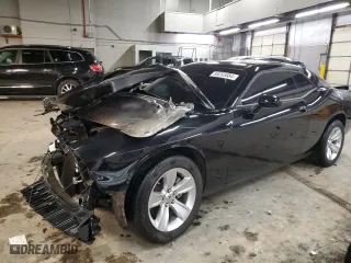 2023 Dodge Challenger SXT with VIN 2C3CDZAG9PH670240, listed as a Copart auction lot 85285584 with 9,057 mi miles and Salvage Title. Bid and sale history available at carsss.com. Image 1.