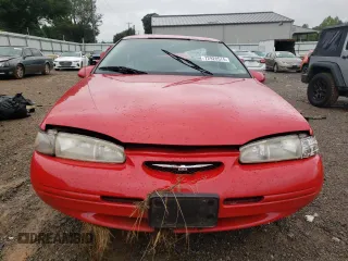1996 Ford Thunderbird LX with VIN 1FALP62W8TH174603, listed as a Copart auction lot 72928574 with 153,614 mi miles and Salvage Title. Bid and sale history available at DreamBid. Image 5.