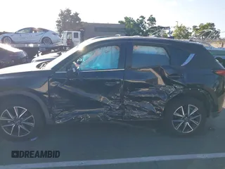 2018 Mazda CX-5 Grand Touring with VIN JM3KFBDM1J0345014, listed as a IAAI auction lot 42703926 with 151,453 mi miles and . Bid and sale history available at DreamBid. Image 6.