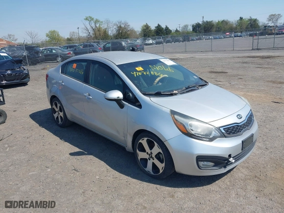 2014 Kia Rio EX with VIN KNADN4A34E6352924, listed as a IAAI auction lot 42072886 with 1 mi miles. Bid and sale history available at carsss.com. Image 1.