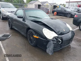 2005 Porsche 911 Carrera z VIN WP0CA299X5S650179, wystawiony jako IAAI lot #42123937 z przebiegiem 52 437 mil mil oraz . Historia ofert i sprzedaży dostępna na DreamBid. Obrazek 1.