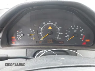 1999 Mercedes-Benz E-Class with VIN WDBJH65F5XA721205, listed as a IAAI auction lot 42068204 with 183,421 mi miles. Bid and sale history available at carsss.com. Image 7.