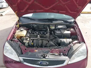 2007 Ford Focus S z VIN 1FAFP31N27W231884, wystawiony jako IAAI lot #41138534 z przebiegiem 84 506 mil mil oraz . Historia ofert i sprzedaży dostępna na DreamBid. Obrazek 10.