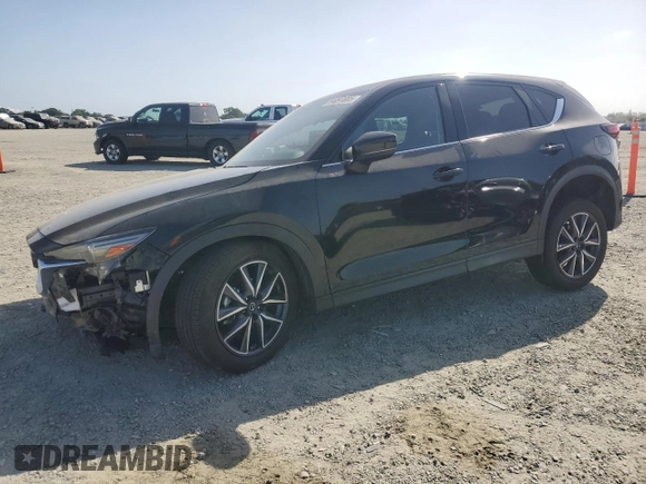 2018 Mazda CX-5 Grand Touring z VIN JM3KFBDM0J0399985, wystawiony jako Copart lot #54097665 z przebiegiem 45 344 mil mil oraz Szkoda całkowita • Salvage title. Historia ofert i sprzedaży dostępna na DreamBid. Obrazek 1.