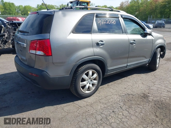 2012 Kia Sorento LX with VIN 5XYKT3A65CG266682, listed as a IAAI auction lot 42220120 with 118,153 mi miles and . Bid and sale history available at carsss.com. Image 4.