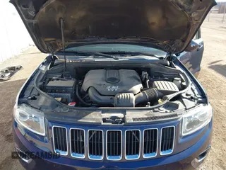 2014 Jeep Grand Cherokee Laredo with VIN 1C4RJEAGXEC206879, listed as a IAAI auction lot 41073934 with 160,457 mi miles. Bid and sale history available at carsss.com. Image 10.