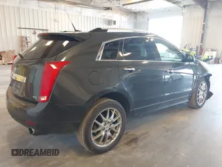 2014 Cadillac SRX Premium Collection z VIN 3GYFNGE38ES606731, wystawiony jako IAAI lot #41844450 z przebiegiem 156 541 mil mil oraz . Historia ofert i sprzedaży dostępna na DreamBid. Obrazek 4.