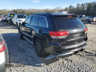 2015 Jeep Grand Cherokee Summit with VIN 1C4RJFJG0FC700014, listed as a Copart auction lot 42981765 with 144,937 mi miles and Salvage Title. Bid and sale history available at DreamBid. Image 2.