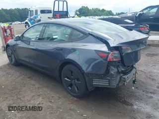 2023 Tesla Model 3 with VIN 5YJ3E1EAXPF628911, listed as a IAAI auction lot 42362410 with 25,387 mi miles and . Bid and sale history available at DreamBid. Image 3.