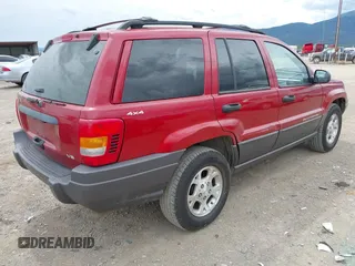2001 Jeep Grand Cherokee Laredo with VIN 1J4GW48N51C732011, listed as a IAAI auction lot 42194017 with 195,716 mi miles and . Bid and sale history available at DreamBid. Image 4.