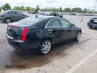 2014 Cadillac ATS Standard AWD z VIN 1G6AG5RX7E0131482, wystawiony jako IAAI lot #42188512 z przebiegiem 53 941 mil mil oraz . Historia ofert i sprzedaży dostępna na DreamBid. Obrazek 4.