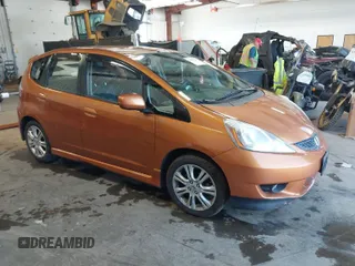 2009 Honda Fit Sport w/Navi with VIN JHMGE88639S044176, listed as a IAAI auction lot 42019347 with 156,880 mi miles. Bid and sale history available at carsss.com. Image 1.