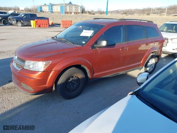 2012 Dodge Journey SE with VIN 3C4PDCAB8CT297188, listed as a IAAI auction lot 41661370 with 157,803 mi miles. Bid and sale history available at carsss.com. Image 2.